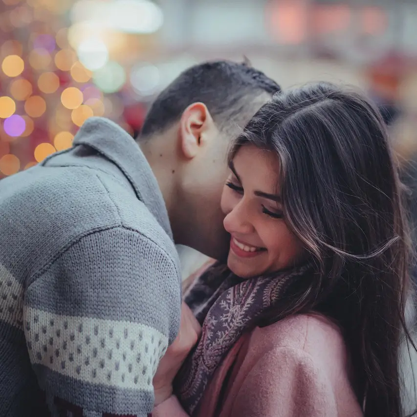 Couple embracing and smiling