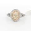 Natural yellow oval diamond center with white & yellow diamond double halo